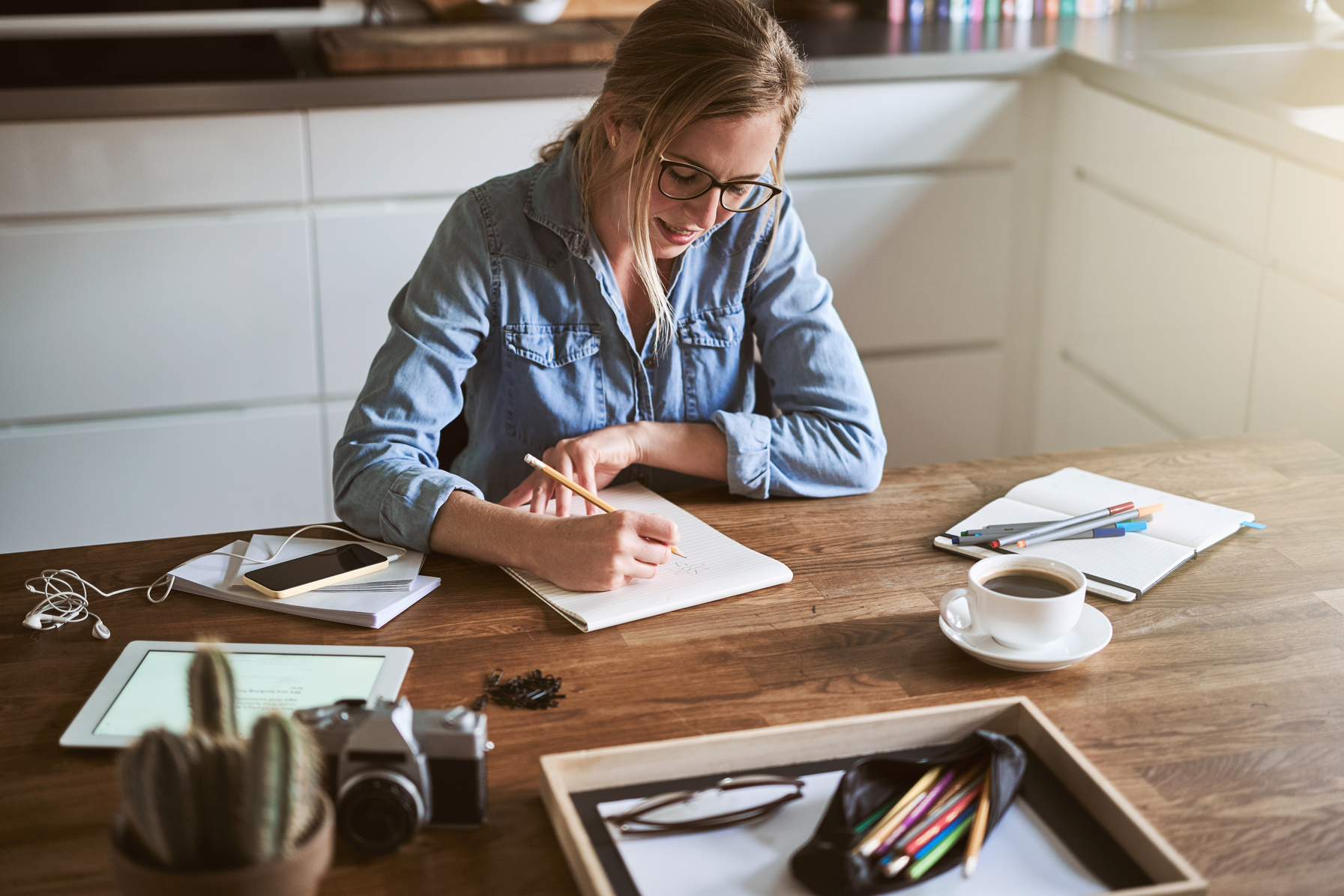 Young Woman Sketching Out Ideas While Working from Home